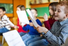 Elementary students singing in music class