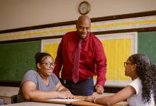 Teacher talking with middle school students