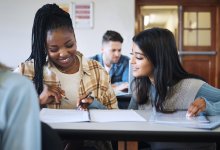 Two high school math students working together