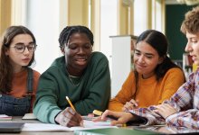 Small group of high school students working together