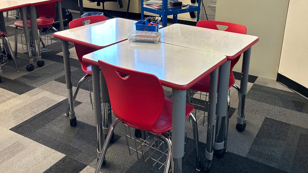 3 desks grouped together