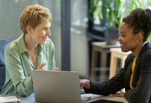 Two coworkers meeting
