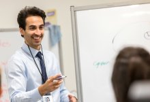 Teacher asking the class a question