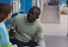 Teacher talking to a student