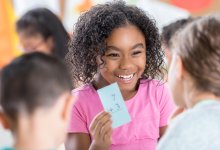 Elementary students using math flashcards