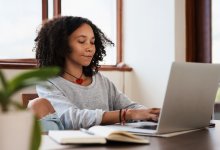 Teen working on a laptop at home