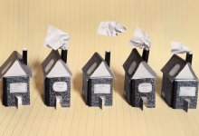 photo of a row of houses made from composition notebooks