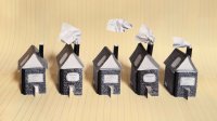 photo of a row of houses made from composition notebooks