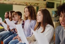 Elementary students singing in music class