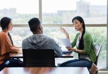 Mentor meeting with teen students