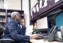 An administrator working contentedly in her office