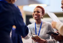 A photo of a teacher engaging with others at a conference
