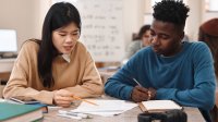Two high school students working together