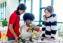 Group of students working on a car project