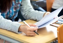 A photo of a high school student looking over an exam