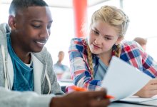 Two students working on a worksheet together