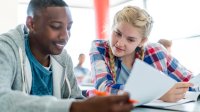 Two students working on a worksheet together