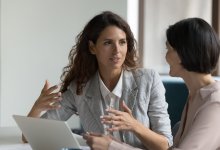 A school administration speaking to a teacher with compassion