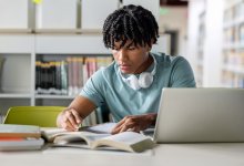 High school student studying in a library