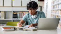 High school student studying in a library