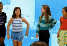 Elementary students playing theater games