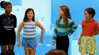 Elementary students playing theater games