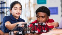 Middle school students working on a project in class