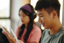 High school students working on a radio theater project