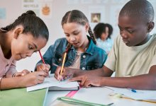 A group of elementary students engaged and working collaboratively
