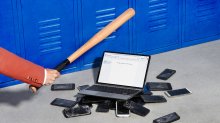 photo of a pile of broken cell phones with an open chromebook on top. An arm on the left of the image is seen holding a baseball bat, ready to break the laptop.