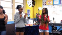 Video still of students playing a theater game