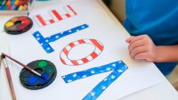 Child working on an election poster
