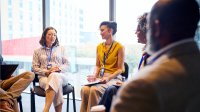 Administrators sitting and discussing in a support circle