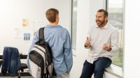 A teacher and student having a positive conversation