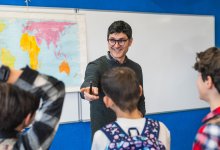 Teacher talking to students before they leave class