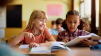Two elementary students working together on an assignment