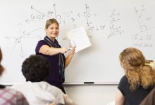 Math teacher at the front of the class