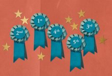 A collection of medals celebrating a teacher's multiple attempts at a task