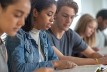 High school students popcorn reading during English class