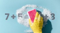 Illustration of a gloved hand cleaning a math equation with a soapy sponge