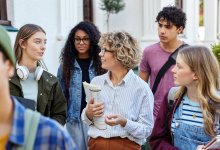 A teacher leading her class on a tour of a public area outside the school