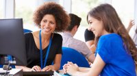 A student and teacher discussing a potential deadline extension