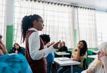 High school students listening earnestly to their teacher