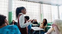 High school students listening earnestly to their teacher