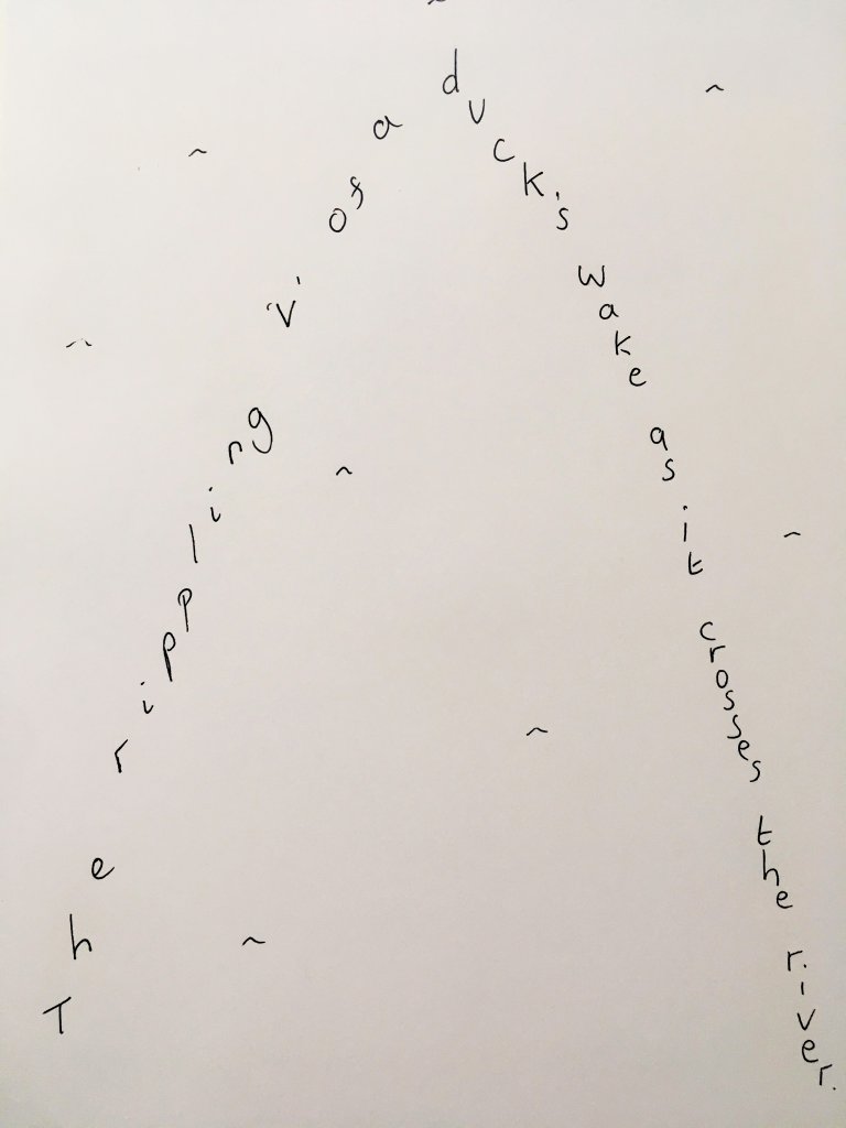 "The rippling 'v' of a duck's wake as it crosses the river" written in the shape of a "v"