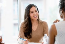 An instructional coach talking with a teacher