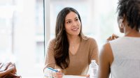 An instructional coach talking with a teacher