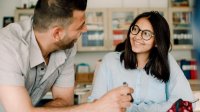 High school teacher working with student