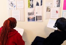 High school students reviewing author biographies
