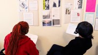 High school students reviewing author biographies